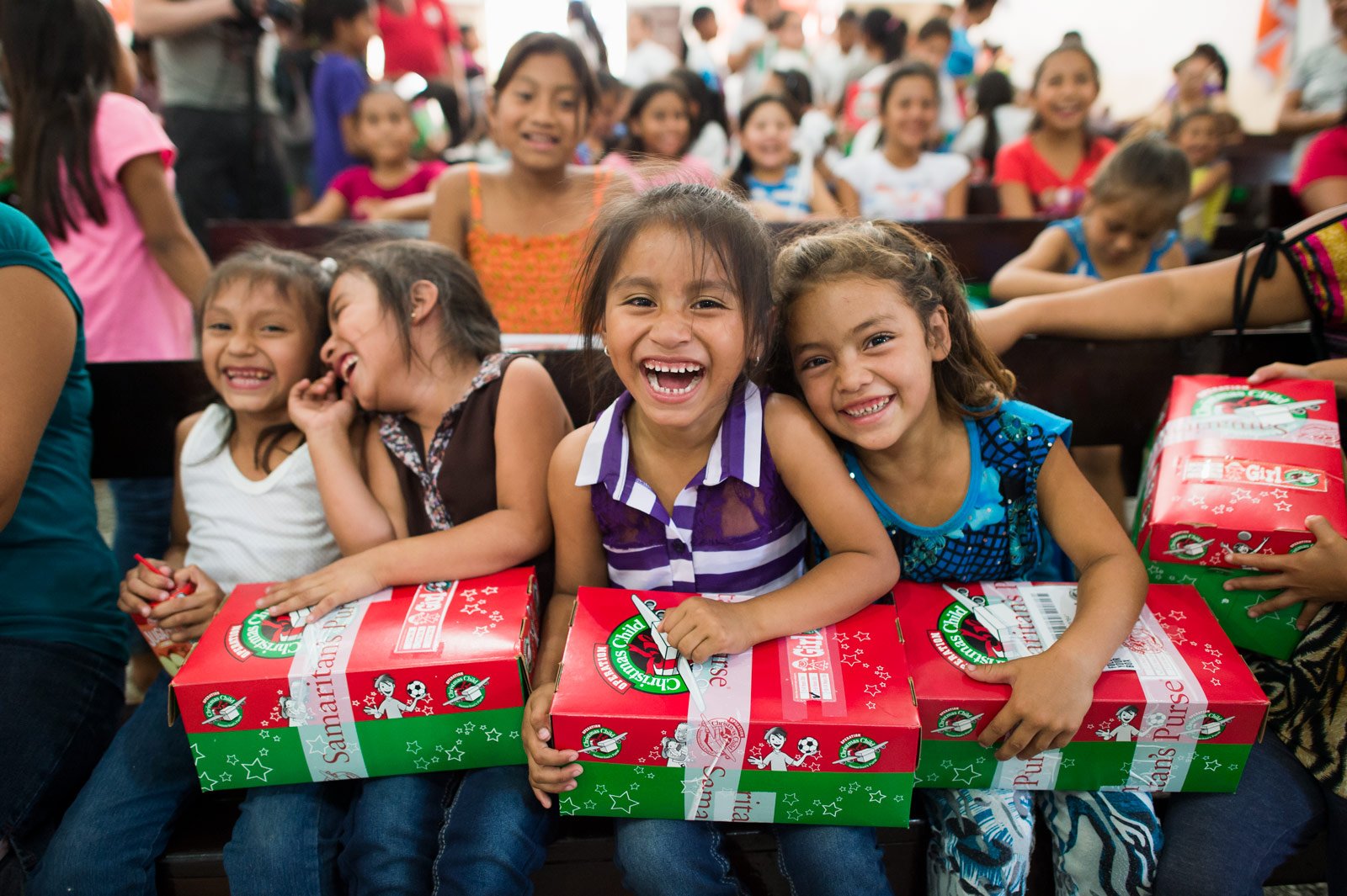 Children receiving Operation Christmas Child shoeboxes